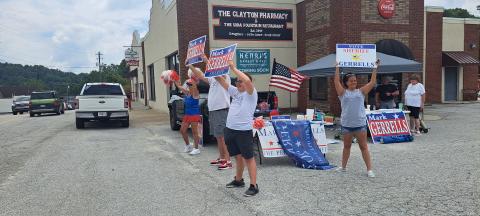 Megan Horn/The Clayton Tribune. Mark Gerrells supporters campaign and cheer on Main Street as passing vehicles honk on Election Day. Gerrells defeated incumbent Sheriff Chad Nichols in Tuesday’s Republican runoff 1,878 votes to 351.