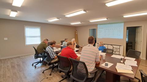 Megan Horn/The Clayton Tribune. RCWSA members review the FY 2025 budget before voting to approve it at the June 11 regular meeting. The water system and wastewater system total budget is $5,646,604. 