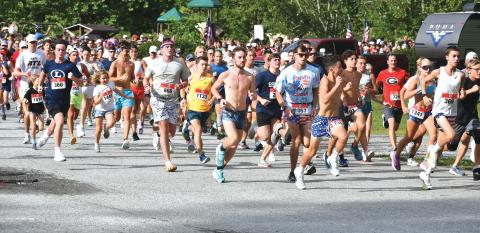 Wade Cheek/The Clayton Tribune. A record 1,564 participants take off during the beginning stages of the Lake Burton Fun Run. In the center, the eventual overall winner Nolan Weisdorfer of Holly, Mich. 