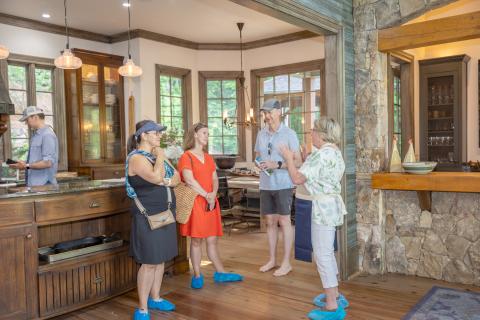 Photo courtesy of Melissa Elzey. In each home, volunteers welcomed visitors and shared details about the property during the Lake Burton Tour of Homes on June 22. 