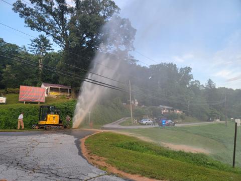 Enoch Autry/The Clayton Tribune. RCWSA personnel work to restore service following a water leak at Falcon Street near Highway 441 and Highway 76 East on the evening of  Saturday, July 20. Officials reported the water leak was caused by a failed pipe.