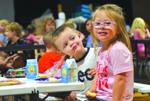 Enoch Autry/The Clayton Tribune. Gatlin Owens looks at his friend Audi Kilby during a day last week at the Mountain City Playhouse.