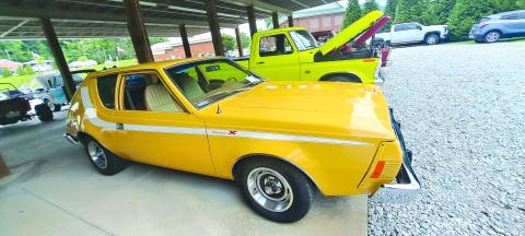 Megan Horn/The Clayton Tribune. This yellow 1974 AMC Gremlin with a 258 6 cylinder engine has its original interior and is owned by Brucz Richter. It was featured at last weekend’s Rockin’ Mountain Motor Show. 