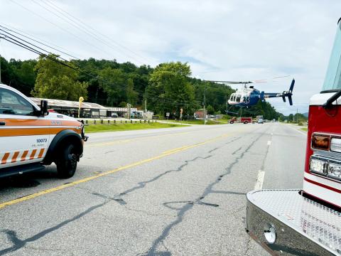 Photo from Rabun County EMS Facebook page. A helicopter lands in the roadway on Ga. 15 at its intersection with Market Circle in Rabun Gap Aug. 6 after a pedestrian was struck by a vehicle. The pedestrian was airlifted to Northeast Georgia Medical Center in Gainesville with suspected serious injuries. 