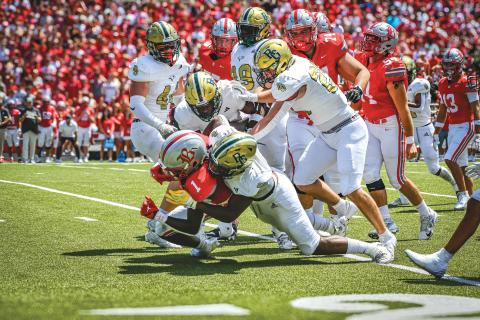 Wade Cheek/The Clayton Tribune. Multiple Rabun Gap defenders join in on a backfield tackle of Ole Miss running back commit Shekai Mills-Knight during the Eagles’ 1 p.m. bout against Baylor School that was broadcast on ESPN on Sunday, Aug. 25. 