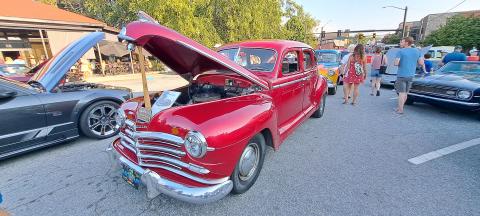 Megan Horn/The Clayton Tribune. This red classic owned by Cody Whitmire was showcased at the Downtown Clayton Block Party with a sign that read “Pharoahs Eastern Region Truckin’.” 