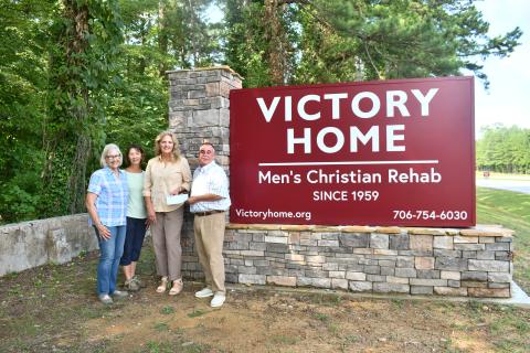 Megan Horn/The Clayton Tribune. Victory Home, a nonprofit in Tallulah Falls, recently received a donation from the Lake Burton Civic Association (LBCA) Foundation to purchase four AEDs for the facility. Pictured are Kathy Booker; Dr. Laura West; LBCA Foundation Chair Robin Gunn-Parker; and Mark Beach, executive director of Victory Home, Inc. Victory Home staff will be trained on how to use the AEDs as well as on Hands Only CPR. 