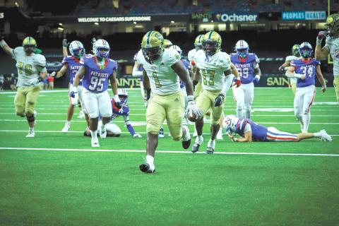 Wade Cheek/The Clayton Tribune. Newly added Rabun Gap-Nacoochee running back and University of Georgia commit Bo Walker runs in for a touchdown in Rabun Gap’s 27-12 win over John Curtis Christian on Friday, Sept. 6, in the Caesars Superdome in New Orleans. The Eagles’ next game is Sept. 20 at home.