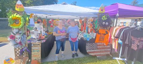 Megan Horn/The Clayton Tribune. This year’s Tiger Corn Festival featured three-times the vendors selling their unique and artistic creations. Janene Bostedt and Susan Imperatore display their creations at the festival Saturday, Sept. 21. 