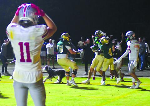 Enoch Autry/The Clayton Tribune. The Hun School’s Bryce Kania (11), a Wake Forest commit, reacts to Rabun Gap’s senior tight end Marshall Pritchett receiving congratulations in the end zone by teammates junior wide receiver CJ Willingham (4), and senior guard and Georgia Tech-commit Justin Hasenhuetl (78) after the North Carolina commit catches a touchdown pass at the end of regulation against Raiders senior free safety and Stanford-commit Liam Thorpe (5). 