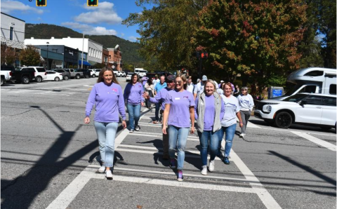 File/Megan Horn/The Clayton Tribune. Fight Abuse in the Home (F.A.I.T.H.) has many events planned for October during Domestic Violence Awareness Month. Pictured are community members participating in last year’s Hope Walk where they wore purple and walked through downtown Clayton while local businesses stood in solidarity holding candles on the sidewalk to bring awareness. This year’s Hope Walk is scheduled for Wednesday, Oct. 2, around 11:30 p.m. at The Rock House, 39 E Savannah Street, Clayton. 