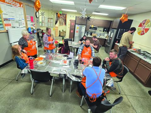 Enoch Autry/The Clayton Tribune. The Home Depot in Clayton associates enjoy a celebratory meal in honor of their six consecutive years of safety excellence.
