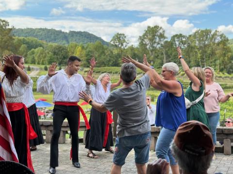 Submitted photo. The Rabun Entertainers as well as guests at the event dance to Italian-themed Harvest songs.
