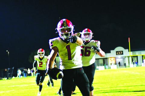 Enoch Autry/The Clayton Tribune. Junior Wildcat running back Lake Evans scores his first of two touchdowns on the road in the first round of the state football playoffs in Fitzgerald. The Purple Hurricane would prevail, 42-21. 