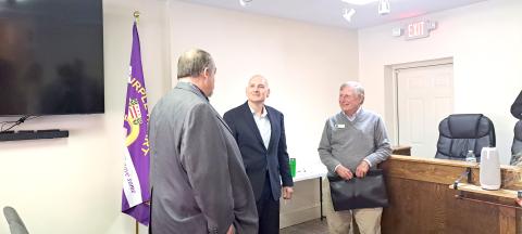 Megan Horn/The Clayton Tribune. Tim Wallis, pictured center, converses with Sky Valley city officials, City Manager Jason Streetman (left) and Council Member Jim Curtis, following Tuesday’s special called council meeting where Wallis was introduced as the new Police Chief for the Sky Valley Police Department. He is expected to start serving as Chief the first week of December.