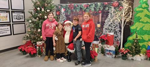 Megan Horn/The Clayton Tribune. It was a fun evening with FFA at the Rabun County Schools Agricenter “Santa on the Farm” event on Thursday, Dec. 5. Raelyn Hunnicutt, 10; Brynlee Hunnicutt, 7; Sophie Chamblee, 9; and Carter Chamblee, 7 are excited to visit Santa and tell him of their wants for Christmas. 