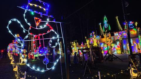 Megan Horn/The Clayton Tribune. Glowing characters and the sounds of holiday music greet visitors to the Christmas Village of Lights displayed at 90 Tiger Connector, Tiger.
