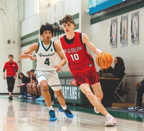 Wade Cheek/The Clayton Tribune. Senior shooting guard Michael Bone (10) drives to the basket during last Saturday’s 79-45 win over Athens Academy on the road. Bone scored 19 points in the region victory.