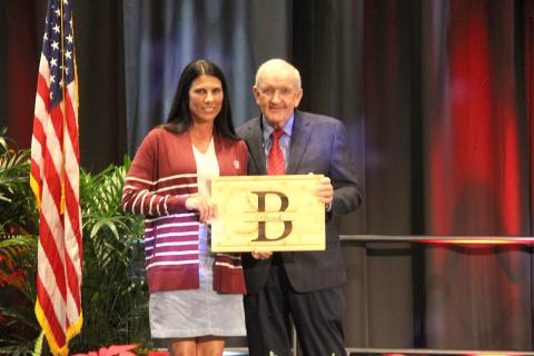 Photo submitted. Rabun County Farm Bureau member Stephanie Harden Branch accepts a gift from Georgia Farm Bureau President Tom McCall during the organization’s 87th annual convention on Jekyll Island in recognition of her serving as chairwoman of the Georgia Farm Bureau Women’s Leadership Committee in 2024. 