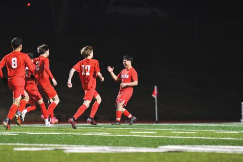 Wade Cheek/The Clayton Tribune. The Rabun County boys soccer team celebrates its victory over North Hall after winning in a penalty-kick shootout. The Wildcats were tied at zero with the Trojans before winning the tie-breaking shootout. 