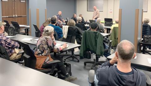 Submitted photo. A group of people listen to Rabun County EMS Capt. Trampes Stancil discuss health risks on Jan. 28 at the quarterly public health talk.