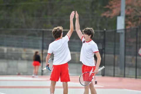 Wade Cheek/The Clayton Tribune. No. 1 Wildcat duo Robbie Fountain and Brady Darnell celebrate a point in their victory over Banks County’s duo (6-0, 6-4). The Wildcats defeated the Leopards 4-1.