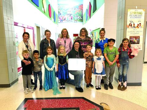 Photo courtesy Rabun County Schools.  Pictured are Back row: Mary Dunham, pre-k teacher, (left); Rachel Dixon, first grade teacher; Jamie Guffie, kindergarten teacher; Laura Welborn, kindergarten teacher; and Heather Stockton, second grade teacher. Front row: Drake Dillard, Jason Bohorquez Hernandez, Ansley Clay, Tori Burt, Principal Carla Truelove, Laith Worley, Lilly Bray, Isaiah Gordon and Rhys Coalley.