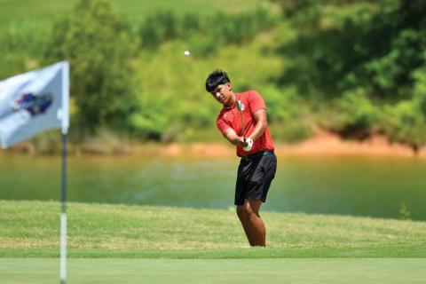 Wade Cheek/The Clayton Tribune. Junior golfer Roberto Diaz chips up onto the green during this week’s Class A-Division I state tournament. Diaz finished seventh as an individual, leading Rabun to an eighth-place finish.