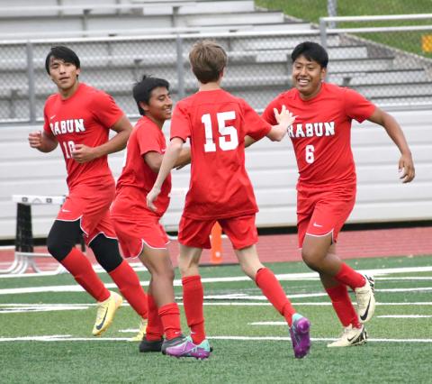 Enoch Autry/The Clayton Tribune. Rabun County junior Christian Avila (6) receives congratulations from his Wildcat teammates on April 25 after Avila scores his second goal of the game against Towers. RCHS won the playoff game 6-2 to advance to play Temple.