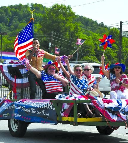 Enoch Autry/The Clayton Tribune. A parade through Rabun County honored local veterans and celebrated America on Armed Forces Day on May 17 as a convoy rolled through Dillard, Mountain City, Tiger and Clayton. Here Ishmael Santos sings on a float with Konstantina Vinson, Barbara Rice, Sharon Purdy and Sue Studstil Crosley. 