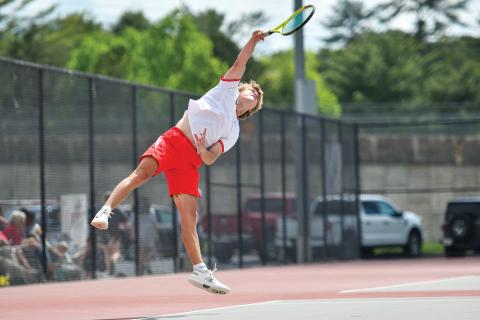 Wade Cheek/The Clayton Tribune. Sophomore No. 2 singles player Landan Bedingfield extends for a rocket serve in Rabun’s 3-0 win over Gordon Central on April 29. The Wildcats defeated the Warriors 3-0 to advance to the Class A-DI quarterfinals. 