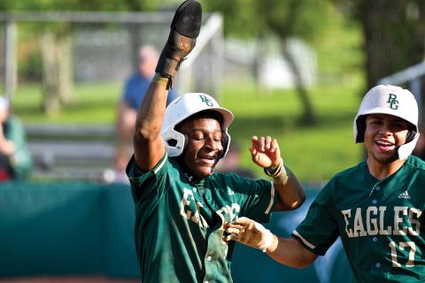 Wade Cheek/The Clayton Tribune. Rabun Gap senior infielders Denajh Williams (left) and Brenden Rosado (right) celebrate runs in their win over Tallulah Falls School. The Eagles have stayed hot since, scoring 12 runs in their most recent win over Christ School.  