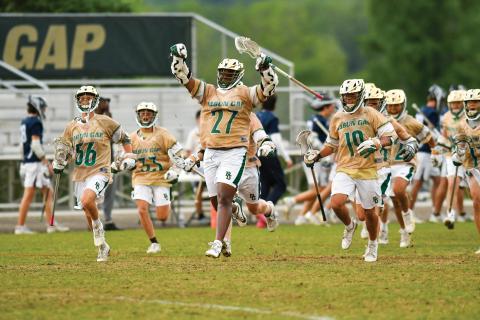 Wade Cheek/The Clayton Tribune. The Rabun Gap-Nacoochee School boys lacrosse team celebrates its quarterfinal victory over Charlotte Latin on Friday, May 9. The Eagles advanced to the semi-final round for the first time in program history. 
