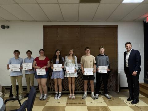 Submitted. Ninth graders honored by the Clayton Lions Club are Silas Stockton (left), Levi Stockton, Ava Sharpe, Mollie Istre, Lydia Gergeni, Colter Cannon and Graham Anderson pictured with Rabun County High School Principal Justin Spillers.