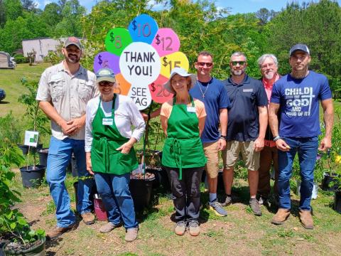 Megan Horn/The Clayton Tribune. Pictured are John Scaduto, Rabun County UGA Extension Coordinator; Nathan Eason, ANR agent/CEC for White County UGA Extension Office; Kathy Booker; Laura West; Steven Patrick, Habersham County UGA extension coordinator; Jonathan Twitty and Dalton Marks with Victory Home, who volunteered during the plant sale. 