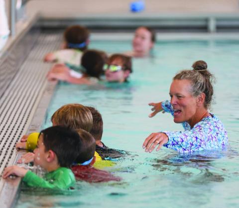 Landen Todd/The Northeast Georgian. Coach Amy Hood leads Tallulah Falls swim campers in a swimming exercise. 