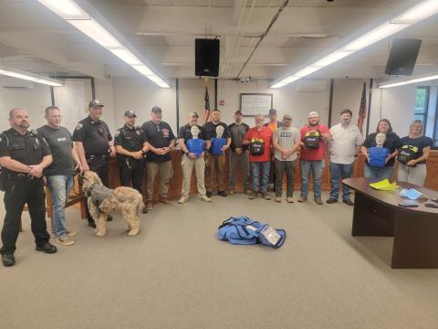 Submitted photo. City of Clayton officials, employees and Clayton Police Department Officers take part in Hands-Only CPR and Automated External Defibrillator (AED) Training at Clayton City Hall on May 14. Rabun County EMS Captain Trampes Stancil instructed and refreshed officials on proper usage. The city recently purchased three AEDs to be used for each patrol shift and have on site. 