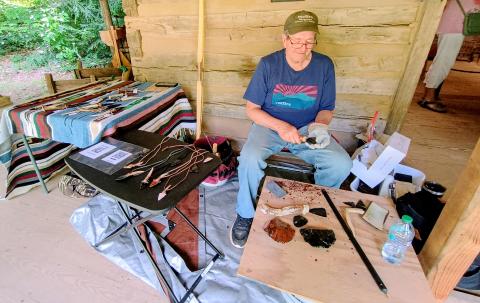 Megan Horn/The Clayton Tribune. Jim Enloe demonstrates Flintknapping at Foxfire Heritage Days last Friday, June 6, and Saturday, June 7. Flintknapping is a skill that has been around for thousands of years and is a term used to describe forming tools and weapons from stone. 