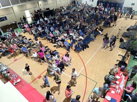 Enoch Autry/The Clayton Tribune. More than 200 people attended the watch party on the Clayton Baptist Church property to celebrate Bryner, the Blue Hound Barbecue and Grill owner. 