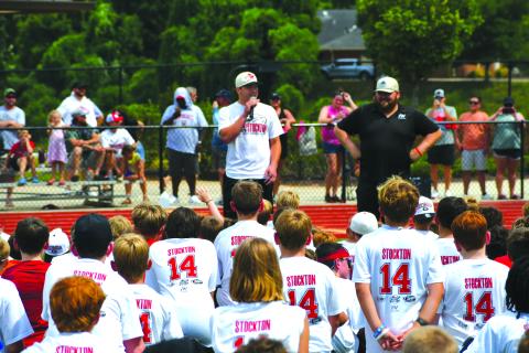 Enoch Autry/The Clayton Tribune. Georgia Bulldogs’ quarterback Gunner Stockton talks with youth at his Gunner Stockton Football Camp at Lakeview Academy in Gainesville, Ga., on July 20. The campers each received a Stockton T-shirt with his jersey number 14 on the back. 