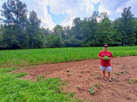 Megan Horn/The Clayton Tribune. Rabun County native Joey Davenport displays this sizeable cabbage he grew in his garden on the east side of Clayton. Gardening for over 70 years, this year’s plantings include cabbage, watermelons, okra, beans, yellow squash, potatoes, sweet potatoes and tomatoes. In the past, the garden produced an 8-pound cabbage. 