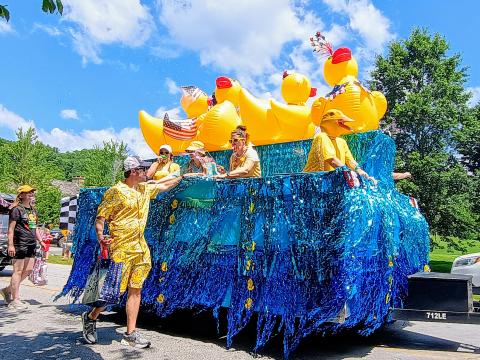 Megan Horn/The Clayton Tribune. This Sky Valley Grand Parade float on July 5 featured giant ducks on water with many decorated participants, marketing the annual Sky Valley Rubber Duck Race that had a lot of happy youth smiling. The float won First Place in the Grand Parade.