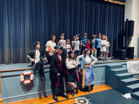 Submitted photo. Grownups (from left) Abbie Boggs, Julie Best, Peyton Wood, Sara Jones and Dannyale Williams of the North Georgia Community Players’ “Treasure Island” pose with youth who helped out as “crew” members.