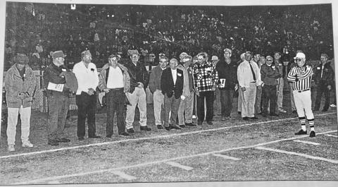 File photo/The Clayton Tribune. Members of the 1949 Rabun County football team served as honorary captains before the Oct. 23, 1998, Wildcat game on “Alumni Night.” The head coach of the first RCHS football team, Richard Burrell, passed away last at the age of 97. Burrell, a history teacher, also coached baseball and boys and girls basketball at RCHS.