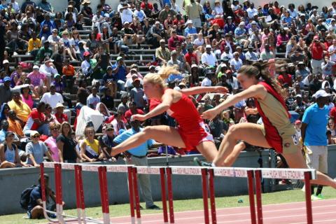 Submitted. Rabun County’s Sally Woerner (left) clears a hurdle during the state finals of 2014.