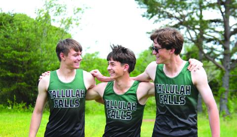 Photo courtesy of Elisha Boggs. Ryan Anderson, Oier Linera Mallea and Gavin Simmons support each other throughout the Tallulah Falls School year. 