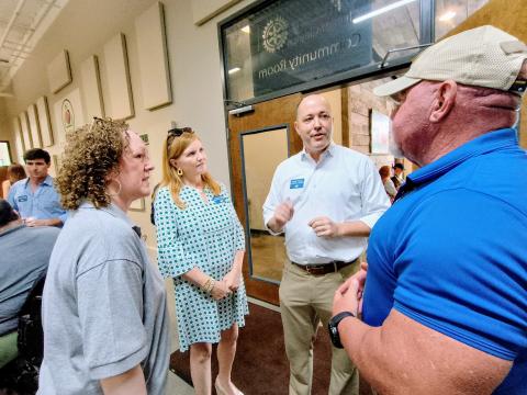 Megan Horn/The Clayton Tribune. Georgia gubernatorial Republican candidate Chris Carr, center, speaks with members of the community during a Friday, Aug. 15, Meet-and-Greet event. Pictured are Benita Cotton-Orr, left; Joan Carr (wife); Carr; and Rabun County Sheriff Mark Gerrells. 