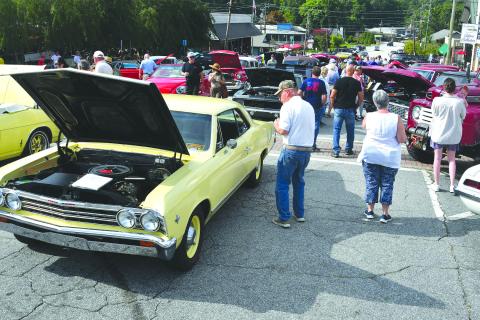 Enoch Autry/The Clayton Tribune. While food trucks were packed in on one end of Main Street in Clayton on Aug. 9, 160 classic vehicles were on hand at the Clayton Block Party for hundreds to check out.