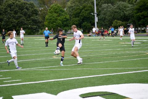 Wesley Branch/TheClayton Tribune. Gabriel Ruelas takes a shot on goal against Asheville High School.