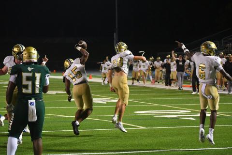 Wesley Branch/The Clayton Tribune. Rabun Gap's defense and sideline celebrate a forced turnover versus Grayson on Aug. 22 